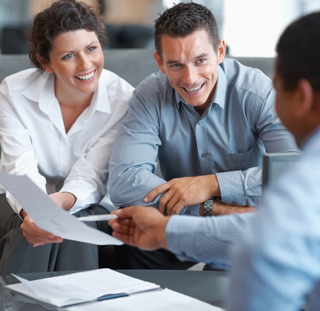 Financial planner helping a couple with their banking accounts